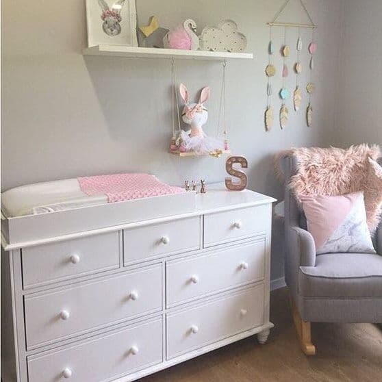 Pink baby change mats cover on a nursery