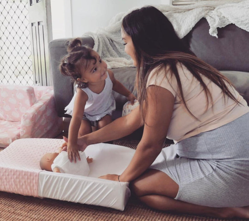 RevieJane nappy change on waterproof cover